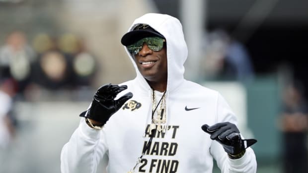 Colorado Buffaloes head coach Deion Sanders walks on the field before the game against the Oregon Ducks at Autzen Stadium.
